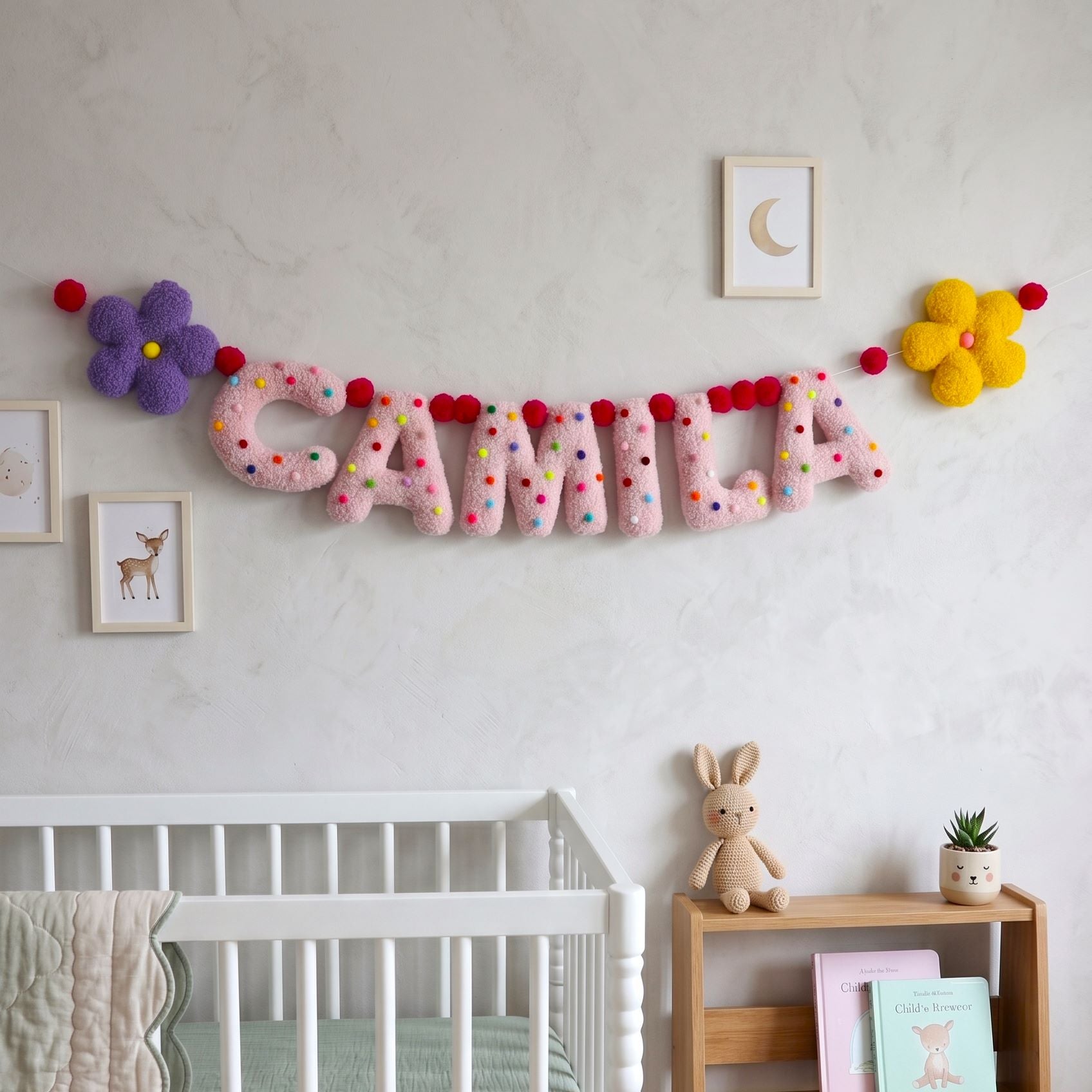 Children's room with a decorative name sign above a crib