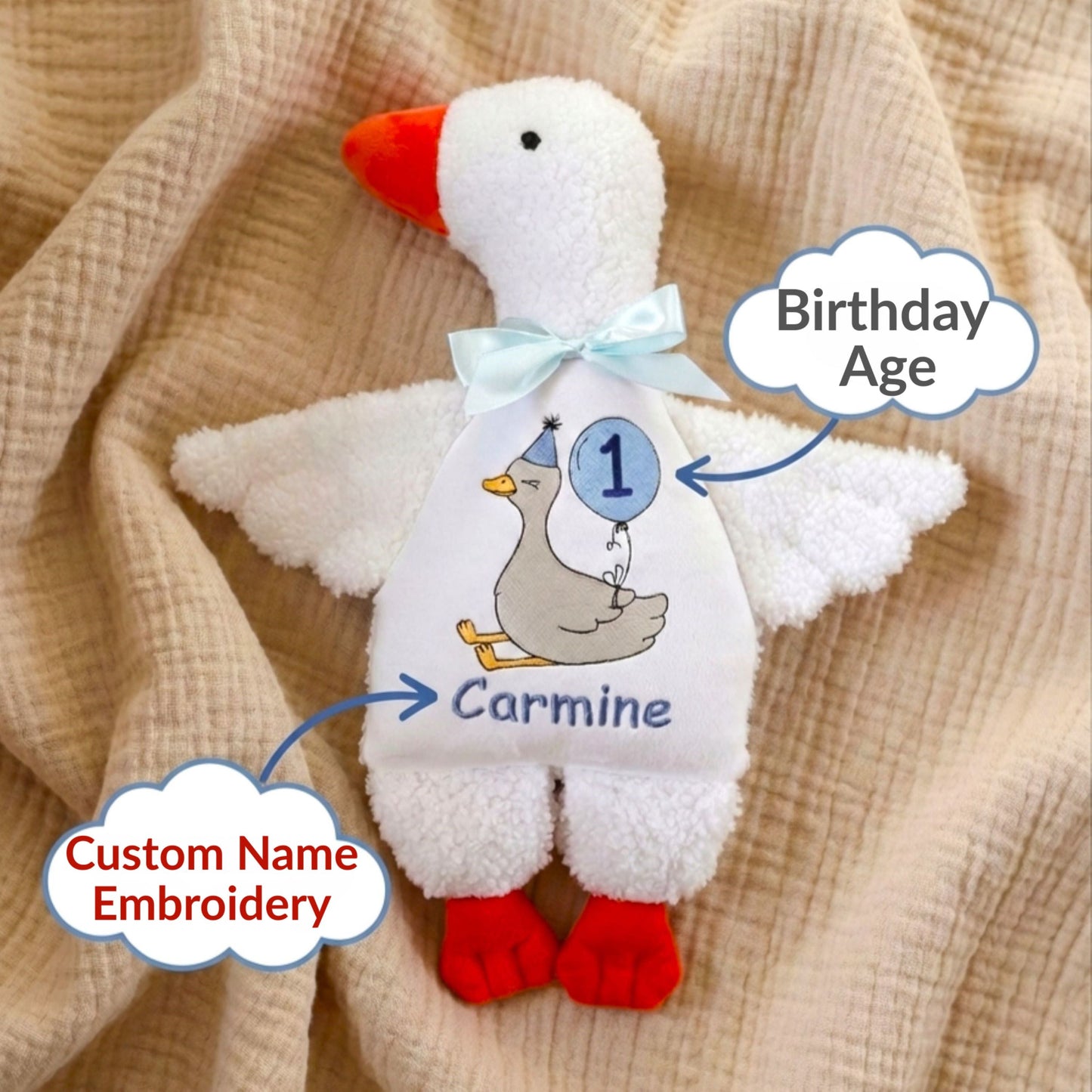 Plush toy goose with embroidered name and age on a beige fabric background