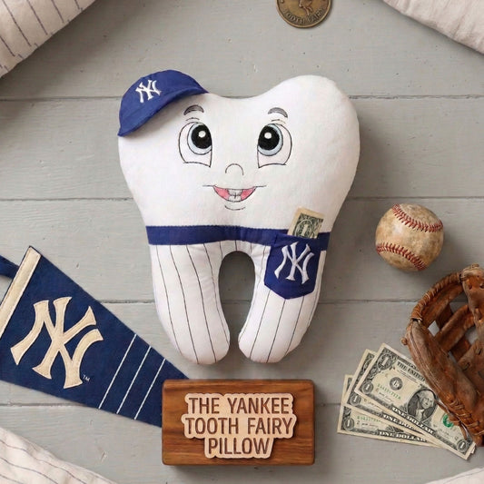 Handmade baseball themed tooth fairy pillow shaped like a smiling tooth character wearing a blue cap and Yankees inspired pinstripe uniform with a dollar bill in its pocket.