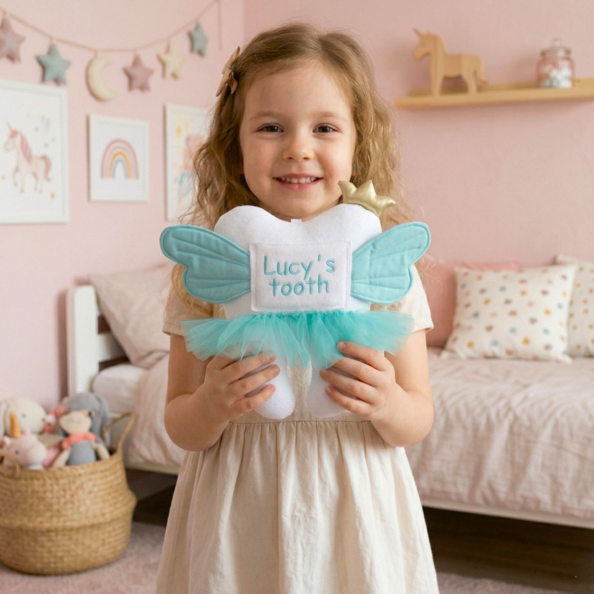Young girl holding a decorative container for Lucy's tooth in a child's bedroom.